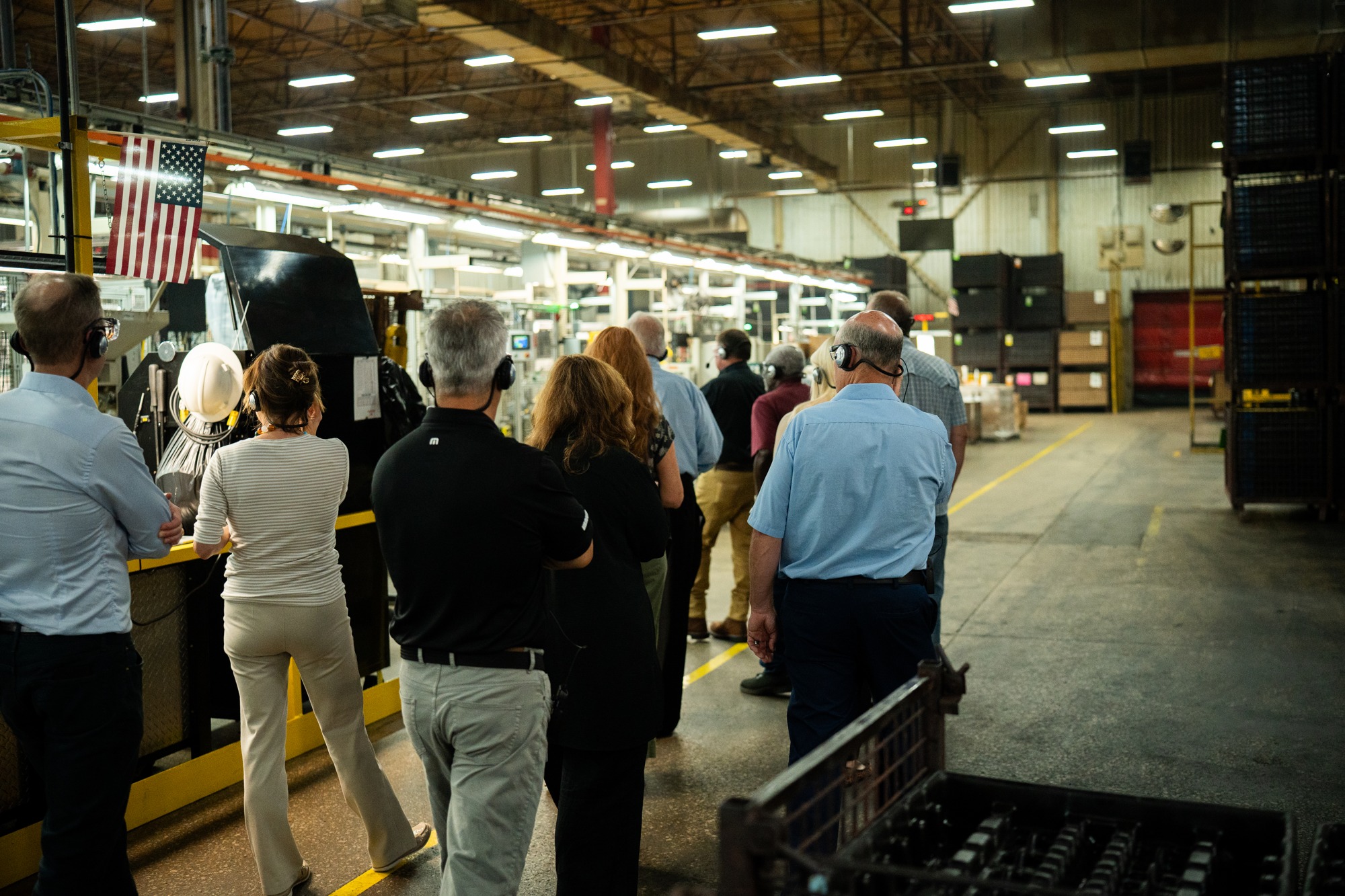 Visitors walking through the Briggs and Stratton Poplar Bluff manufacturing facility