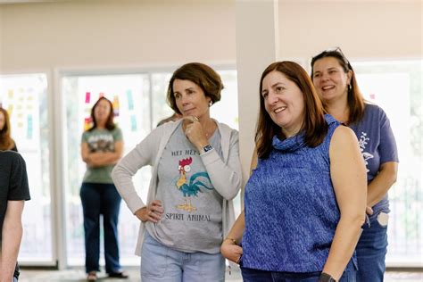 Kristina Lugo standing with Avenidas colleagues during a community gathering