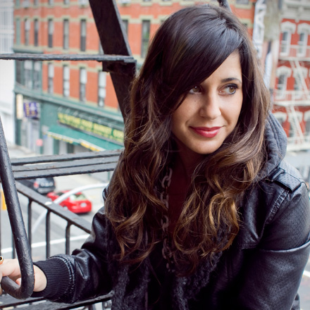 Krystle Mobayeni beside a New York fire escape in her 2011 designer profile