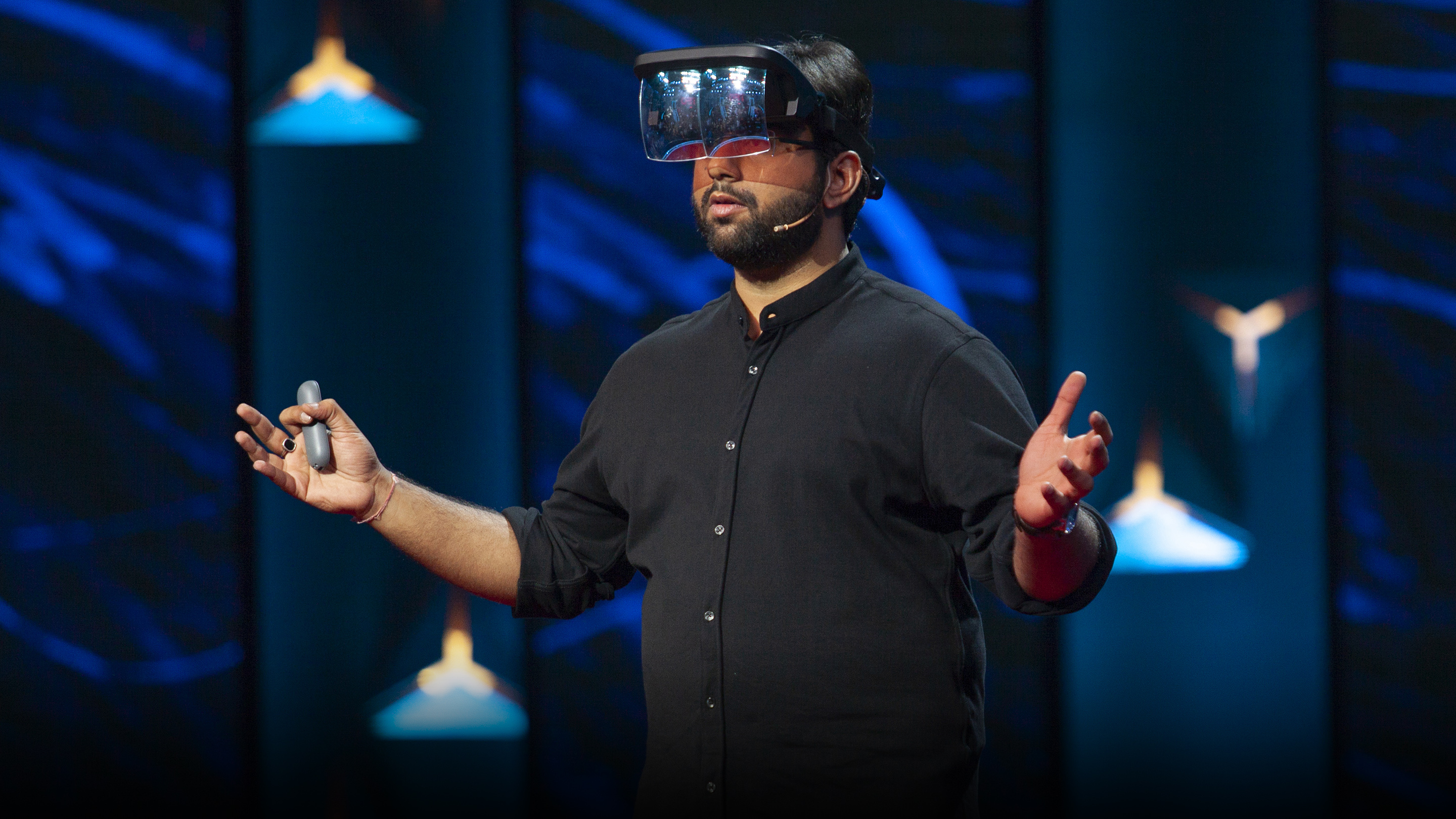 Kshitij Marwah demonstrates a mixed reality headset on the TED Talks India stage