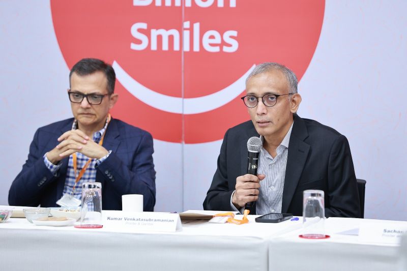 Kumar Venkatasubramanian holding a microphone at a FICCI FMCG Committee meeting in Mumbai