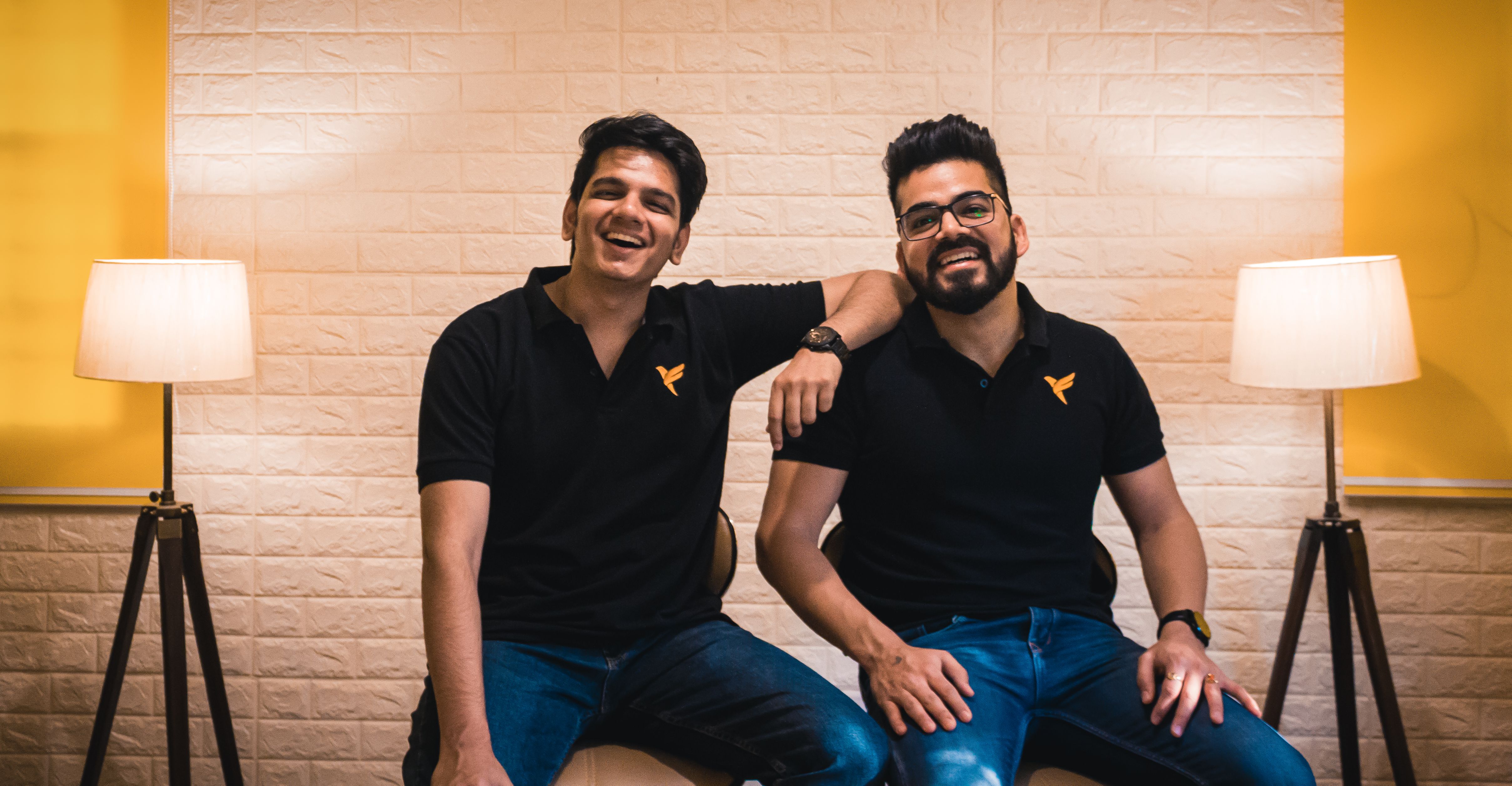 FamPay co-founders Sambhav Jain and Kush Taneja seated together in the company office