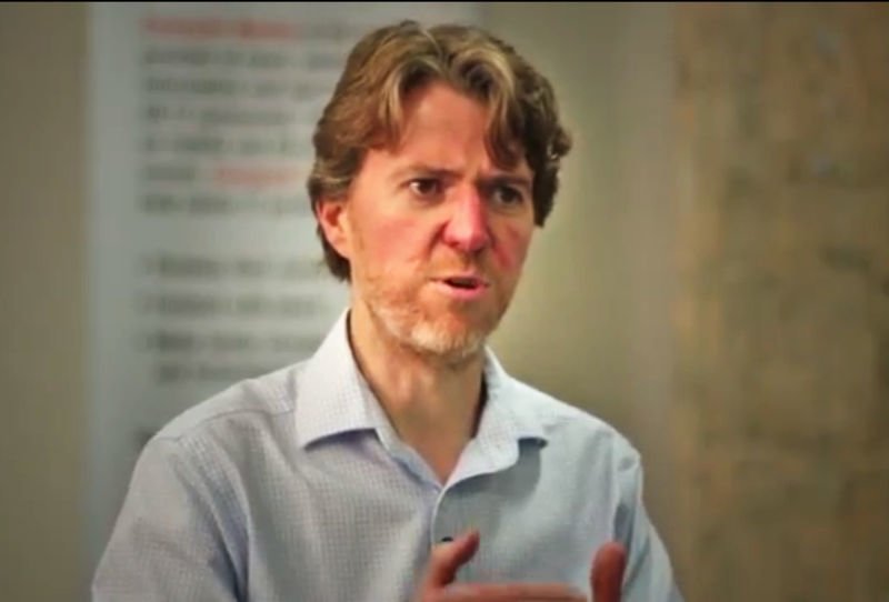 Ky Nichol speaking during a filmed interview
