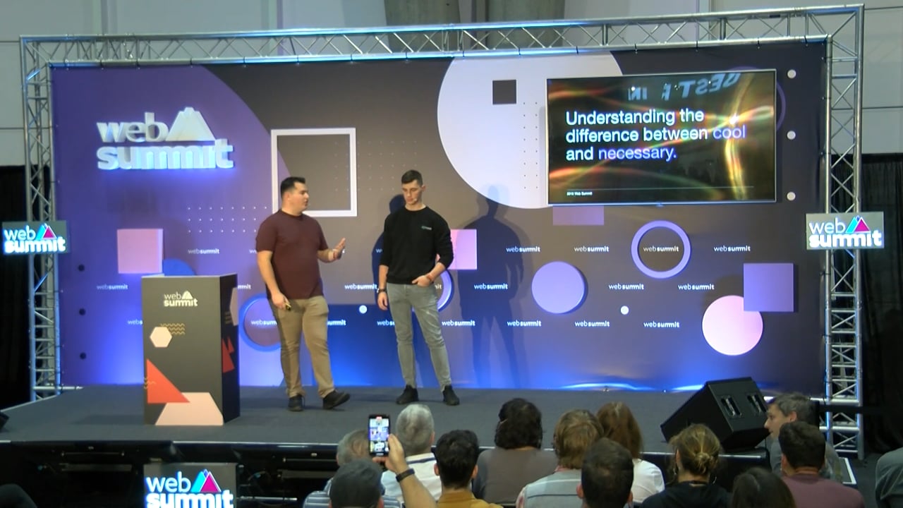 John Andrew Entwistle and Kyle Carberry speaking on a Web Summit stage in 2019