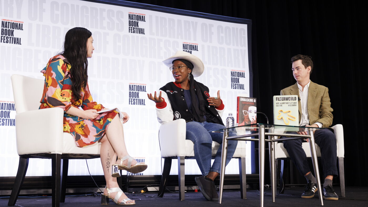 Regina Barber, Joy Buolamwini, and Kyle Chayka seated onstage at the 2024 National Book Festival