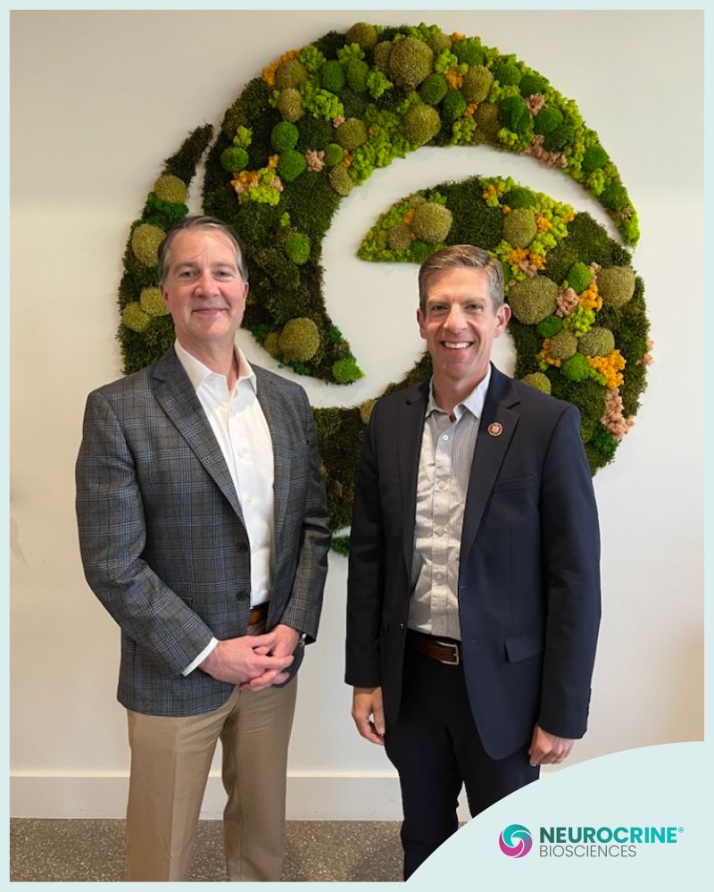 Kyle Gano, left, standing beside Congressman Mike Levin at Neurocrine’s campus