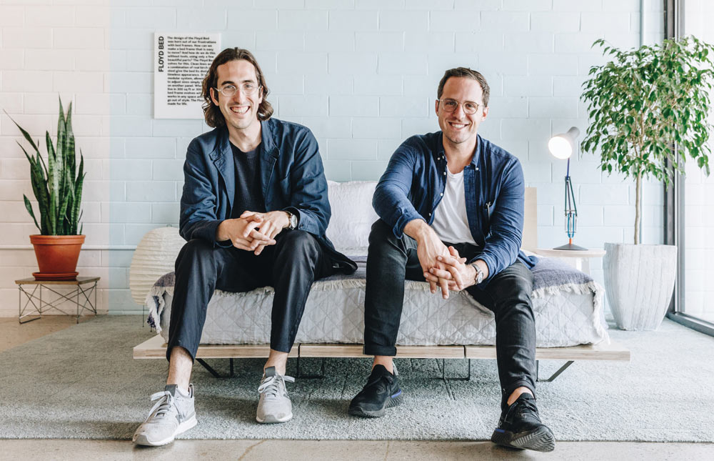 Kyle Hoff and Alex O'Dell seated together in Floyd's Detroit workspace