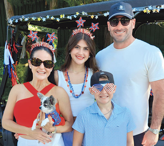 Kyle McElvaney, at right, with his family and Coco at the Nichols Hills Fourth of July parade in 2026