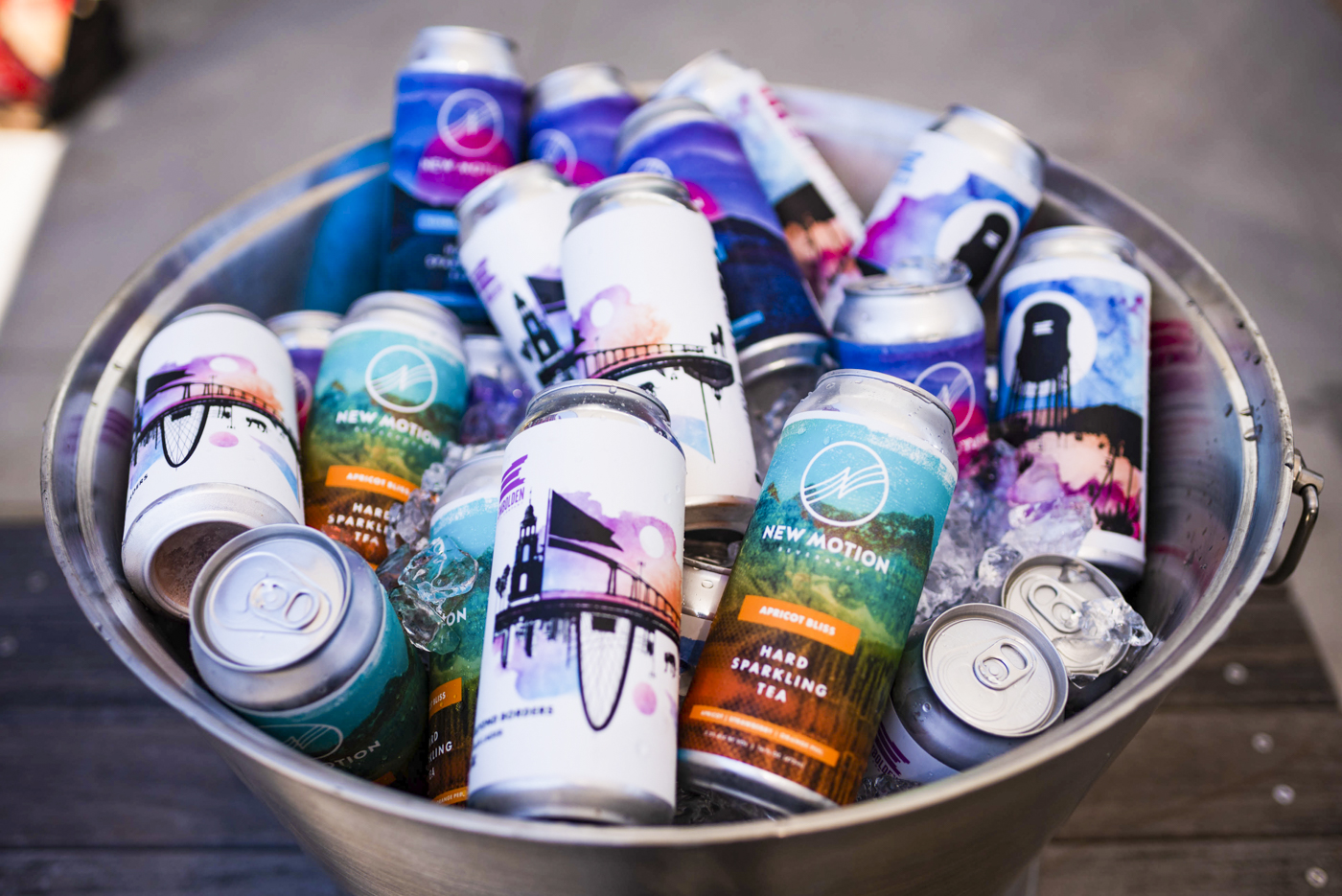New Motion beverage cans arranged in a metal tub of ice