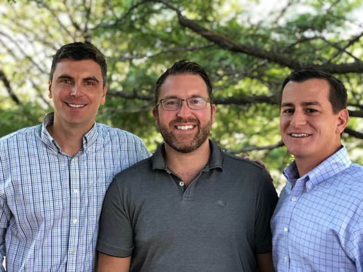 York IE co-founders Adam Coughlin, Kyle York and Joe Raczka standing together outdoors
