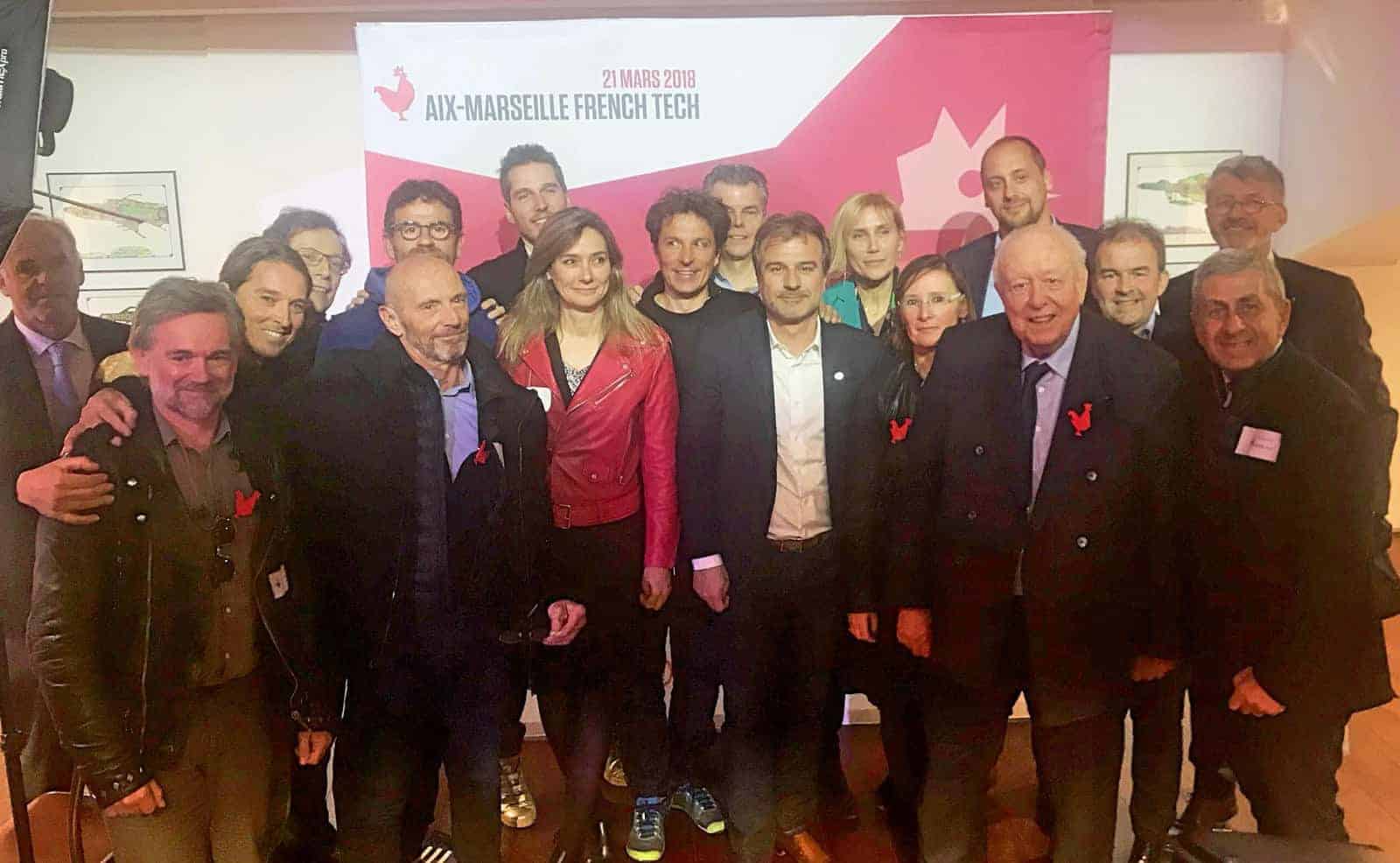 Participants in the Aix-Marseille French Tech launch gathering in March 2018, several wearing red rooster badges