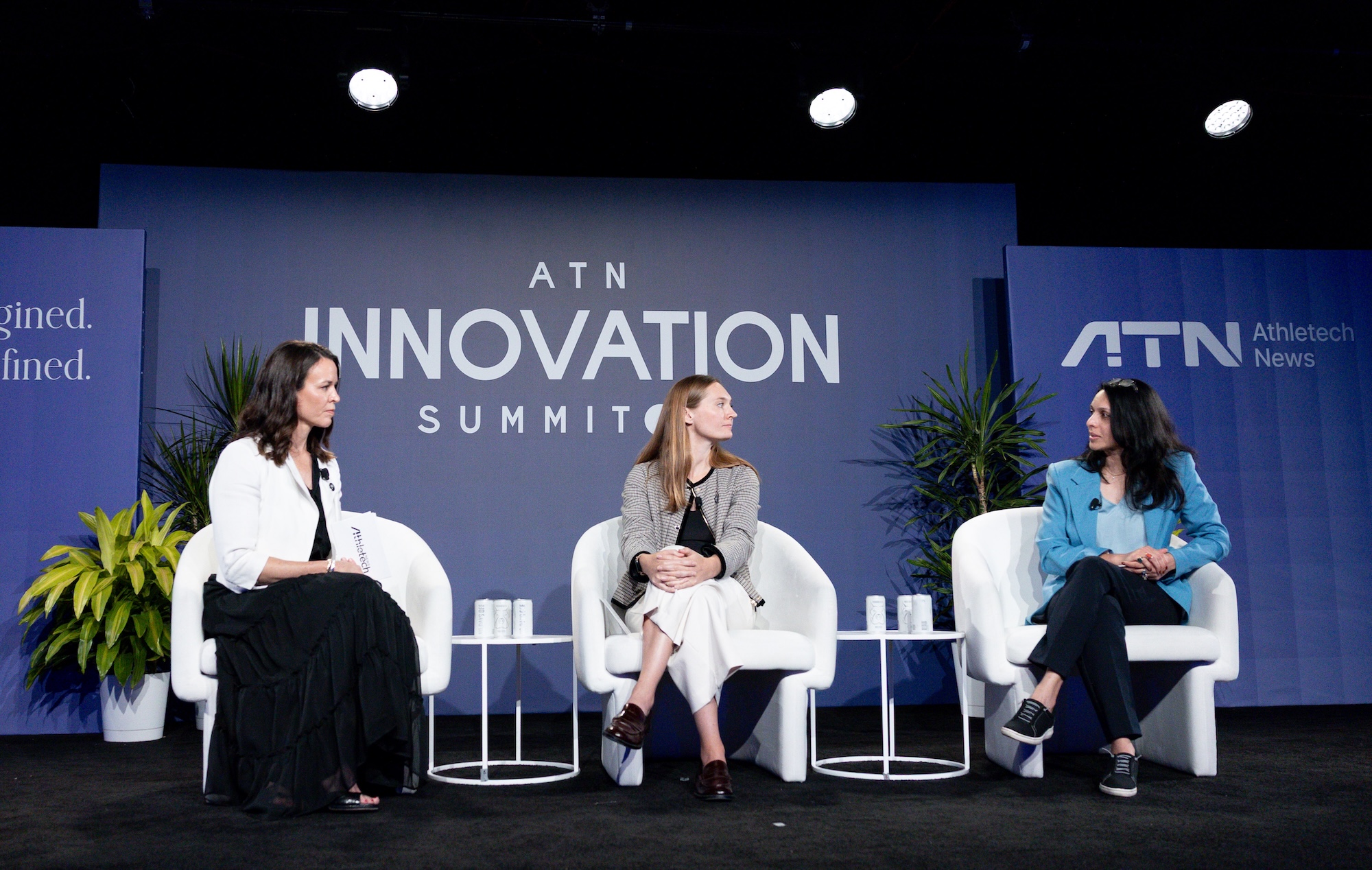 Lacey Ford, Madeline Verbeten and Rachana Jain seated onstage at the 2026 Athletech News Innovation Summit