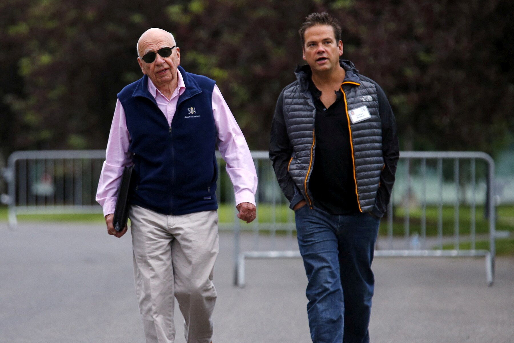Rupert Murdoch, left, and Lachlan Murdoch walking together in outdoor jackets in 2015.