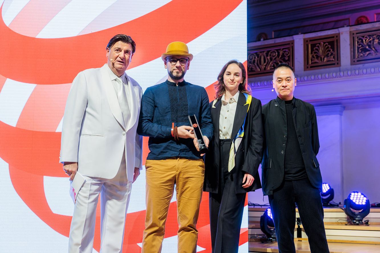 Lada Leitsius and Qubstudio representatives onstage at the 2022 Red Dot award ceremony in Berlin