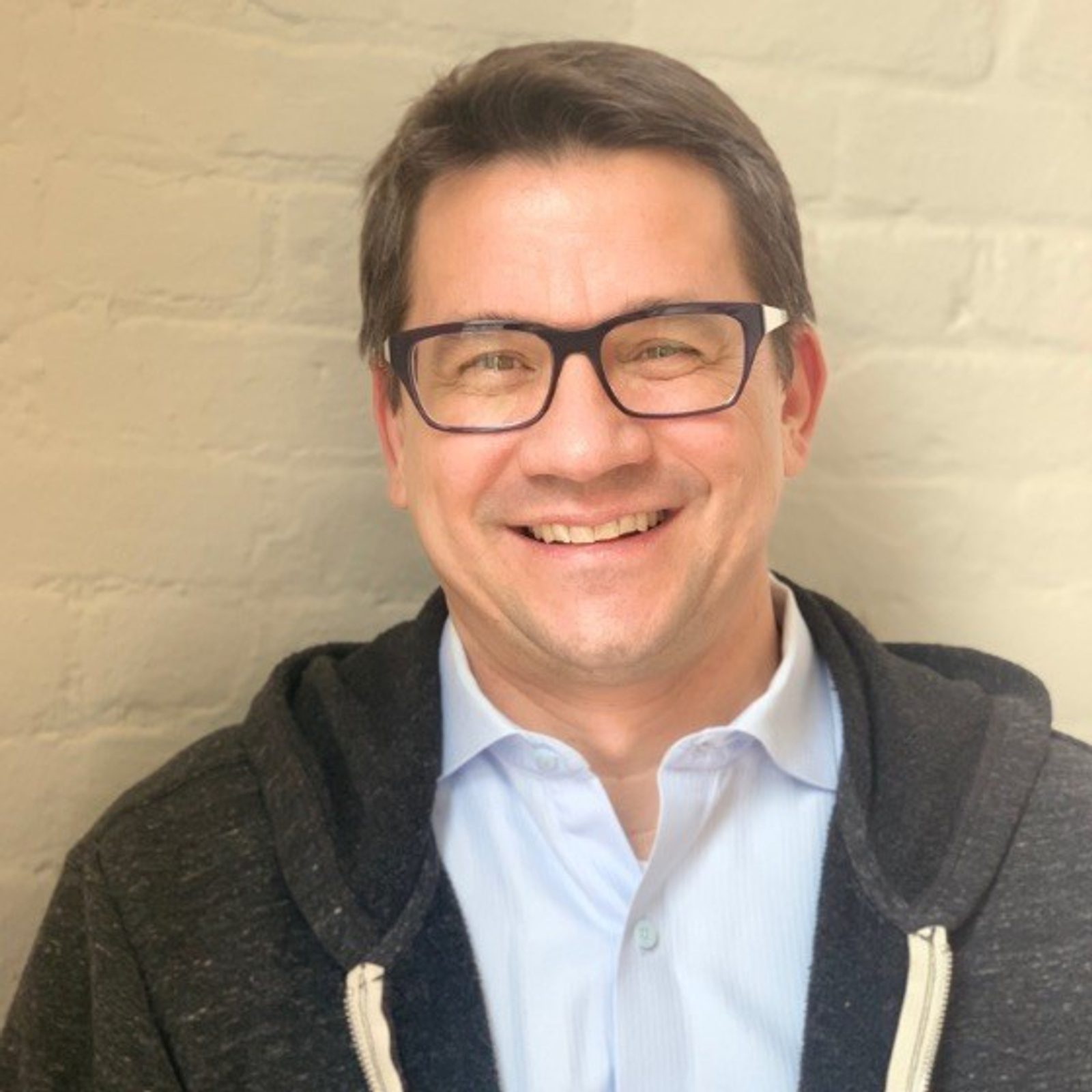Ladders co-founder Marc Cenedella wearing glasses and a dark jacket