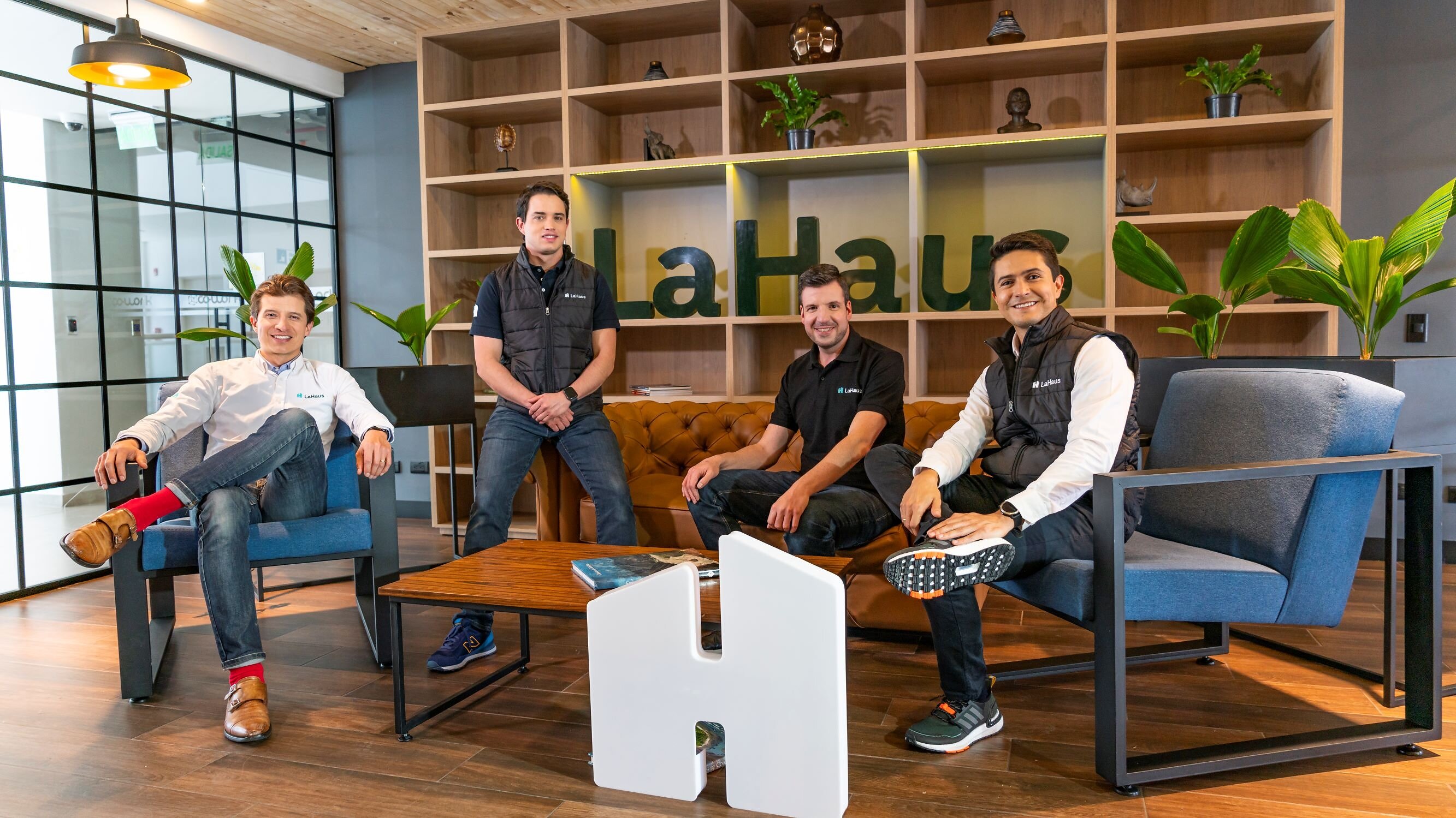 Four members of LaHaus’s leadership team in an office in 2021