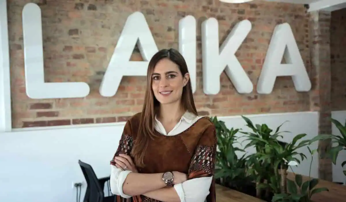 Laika cofounder and CEO Manuela Sánchez standing in front of the company name