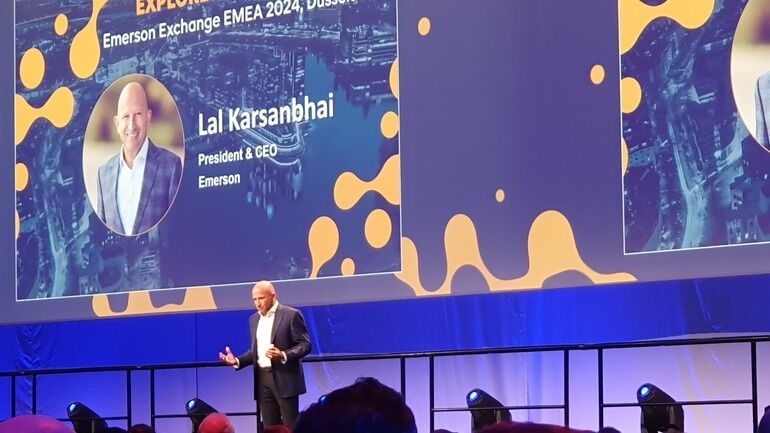 Lal Karsanbhai speaking onstage at Emerson Exchange EMEA 2024 in Düsseldorf