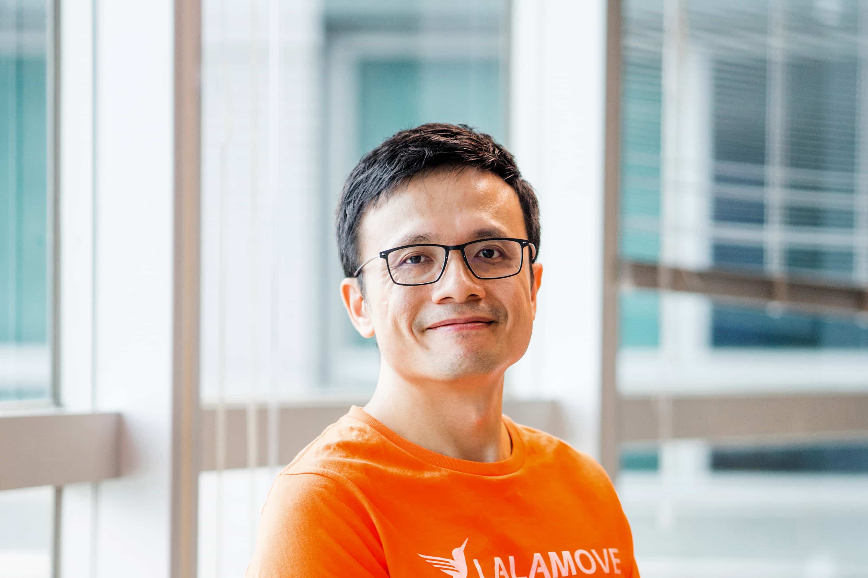 Lalamove founder Shing Chow seated for a portrait