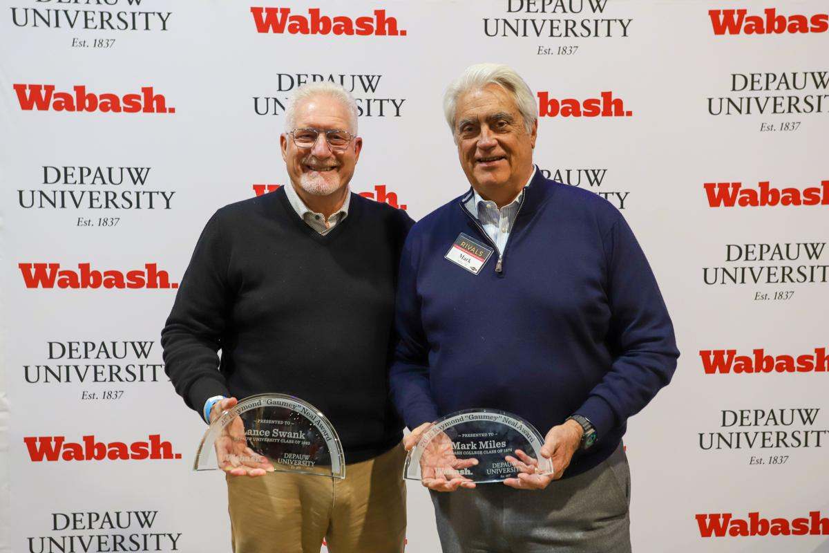 Lance Swank on the left and Mark Miles on the right holding their Gaumey Neal awards