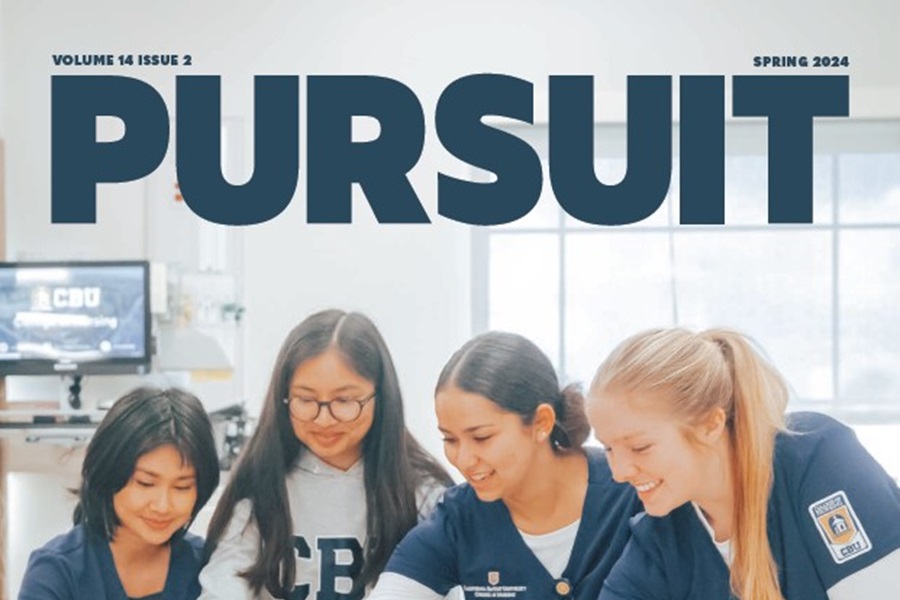 Detail of Pursuit’s spring 2024 cover showing students gathered around their work