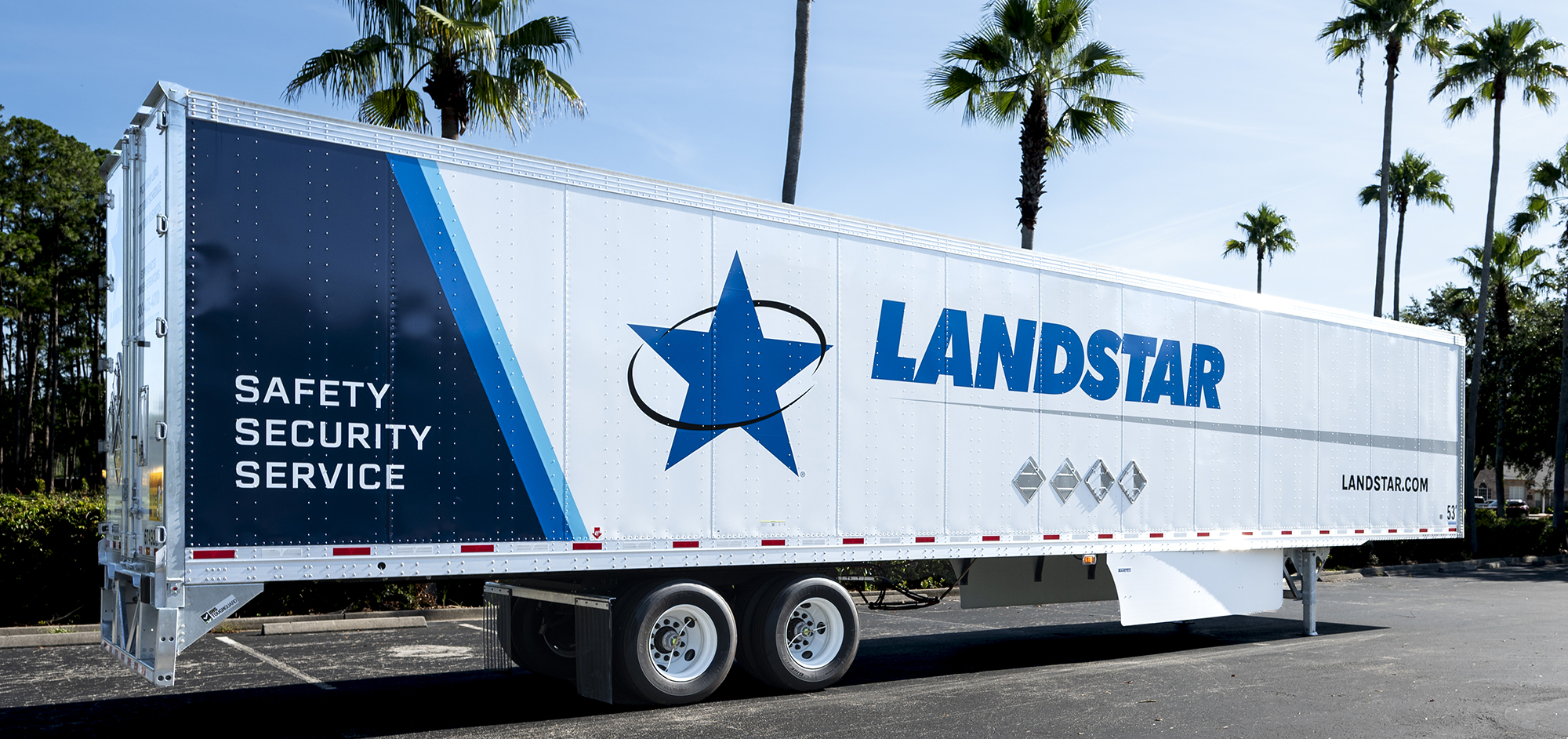 Landstar’s refreshed white and blue dry van trailer displayed in Jacksonville
