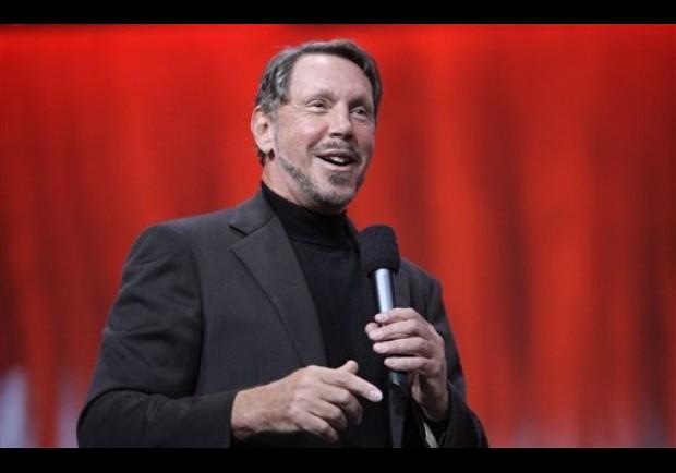 Larry Ellison speaking into a microphone at Oracle OpenWorld