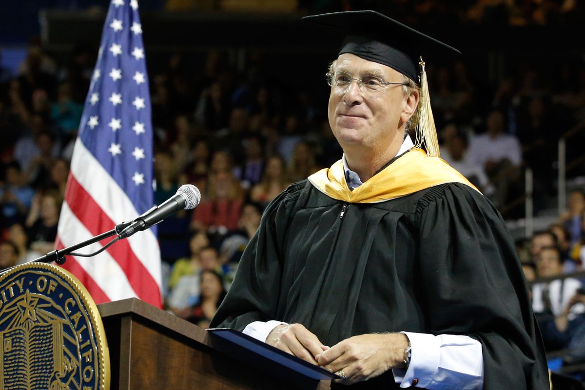 Larry Fink at a lectern in academic robes during UCLA’s 2016 commencement
