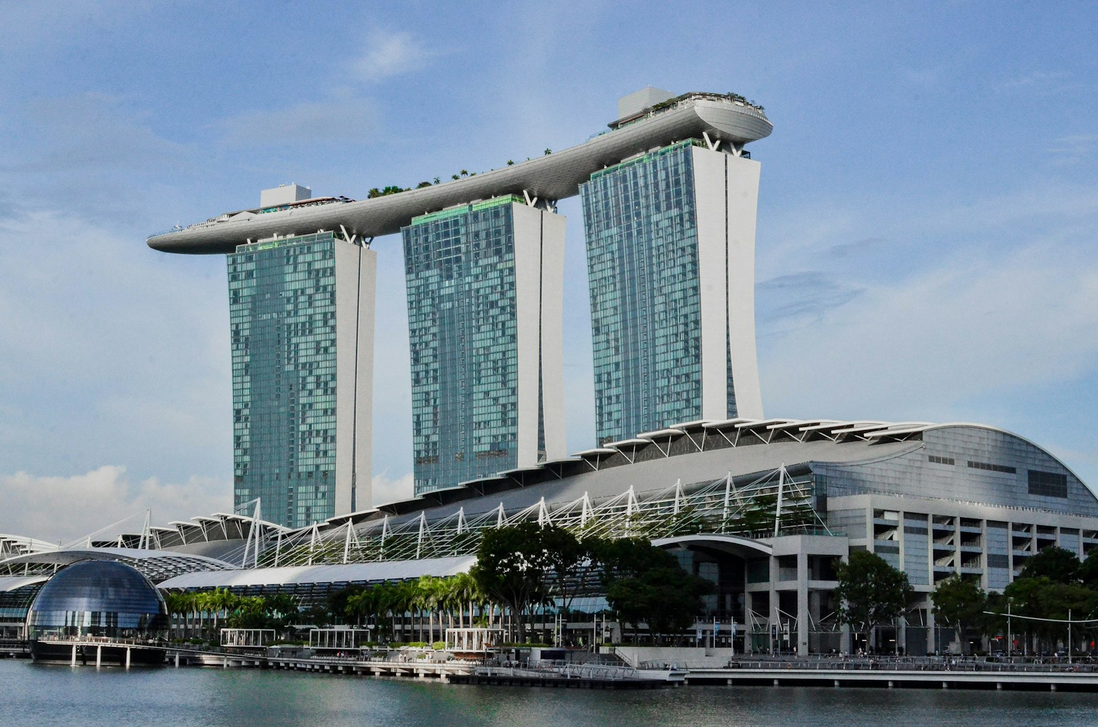 Marina Bay Sands’ three hotel towers and rooftop SkyPark beside Singapore’s waterfront
