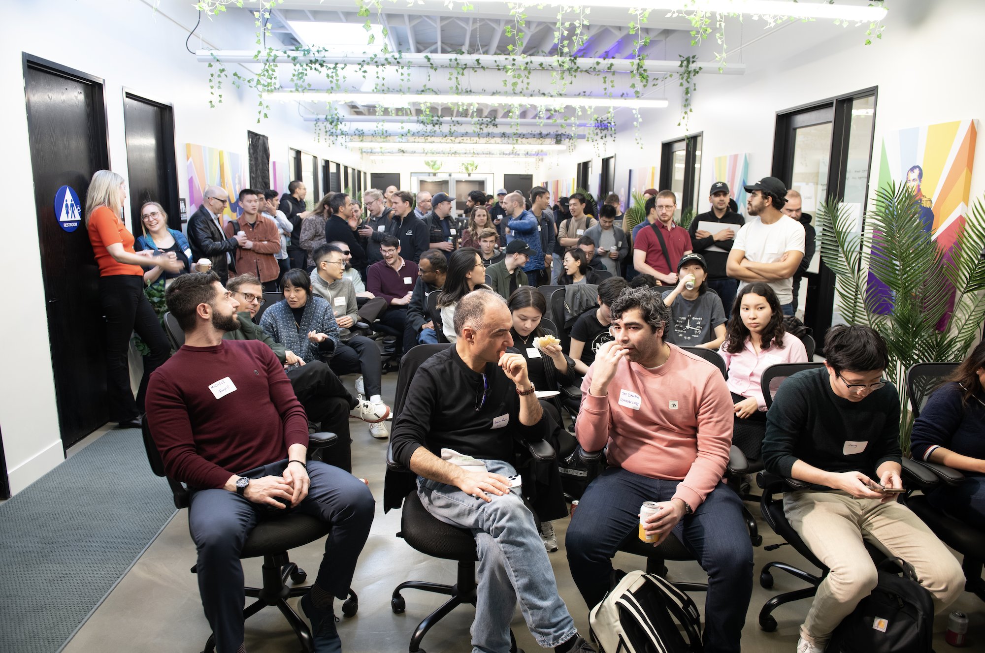 Attendees talking and taking their seats at Latent Space's Final Frontiers gathering