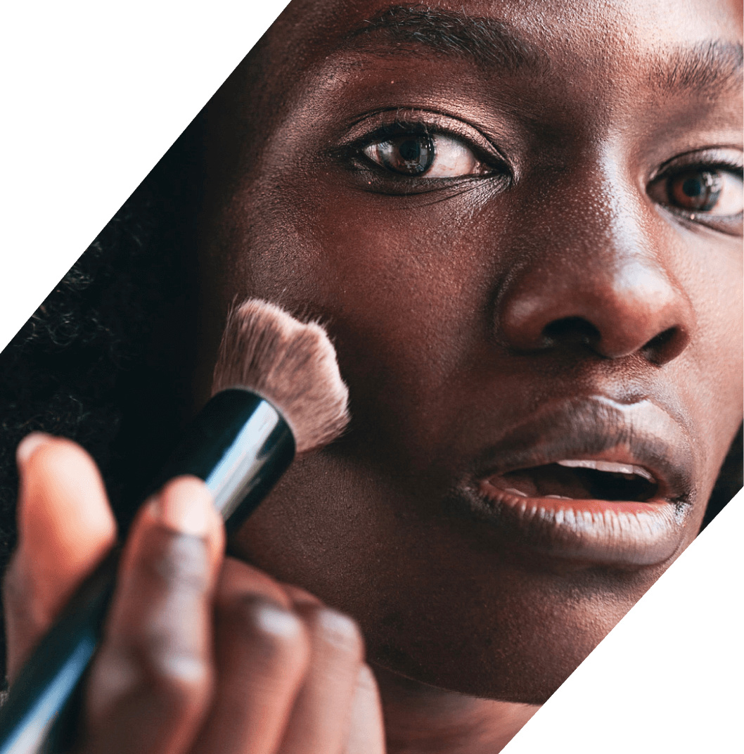 Beauty creator imagery used on Later’s website, showing a makeup brush in use