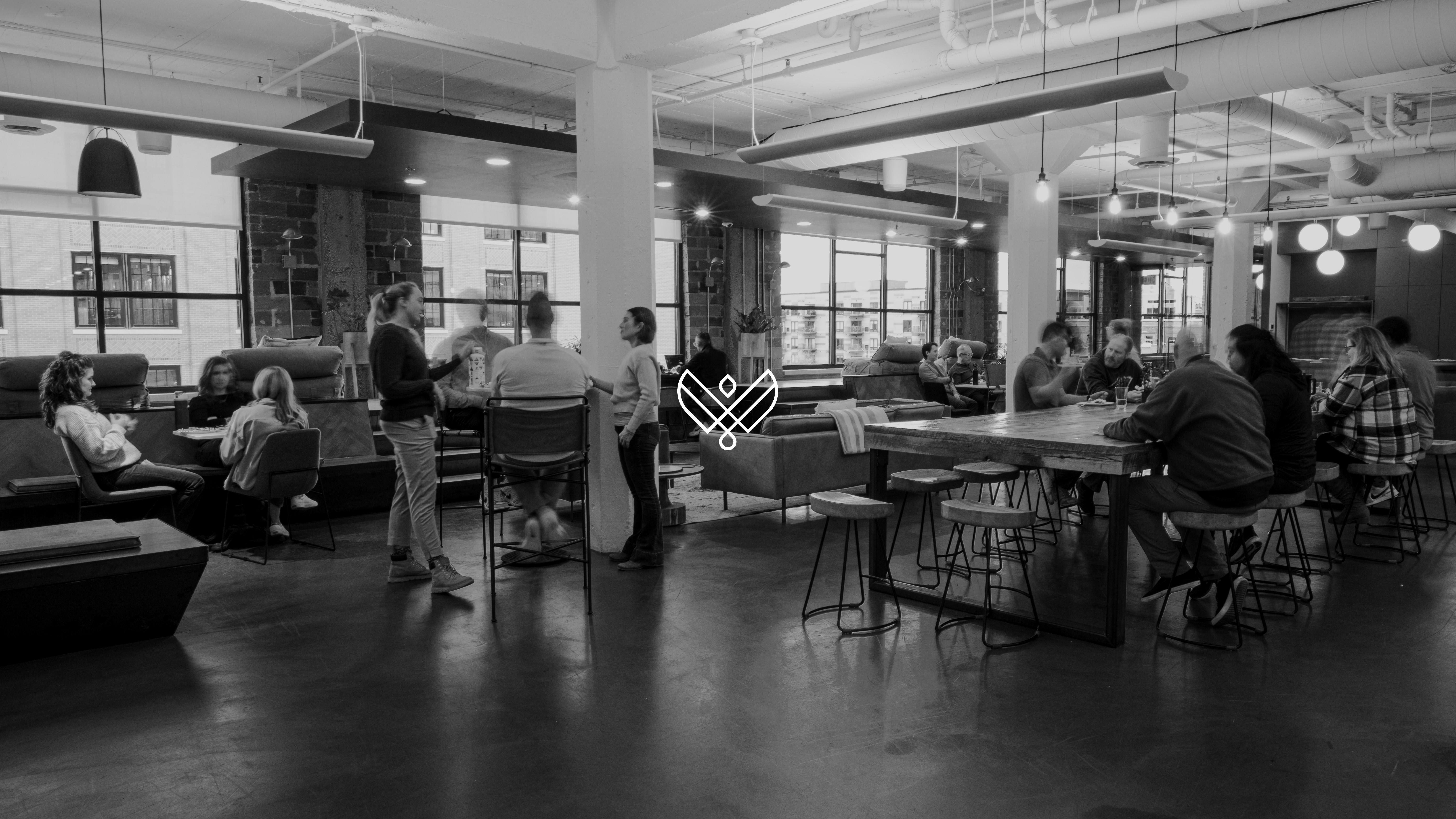 Latitude team members working and meeting inside the agency's Minneapolis office
