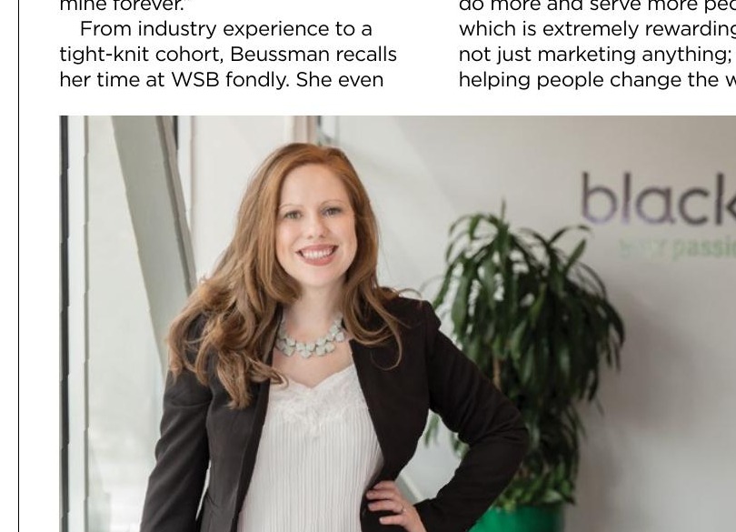 Laura Beussman standing in a Blackbaud office in 2018