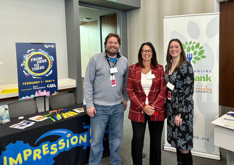 Laura Prieskorn, center, with two attendees at a Jackson community appreciation event