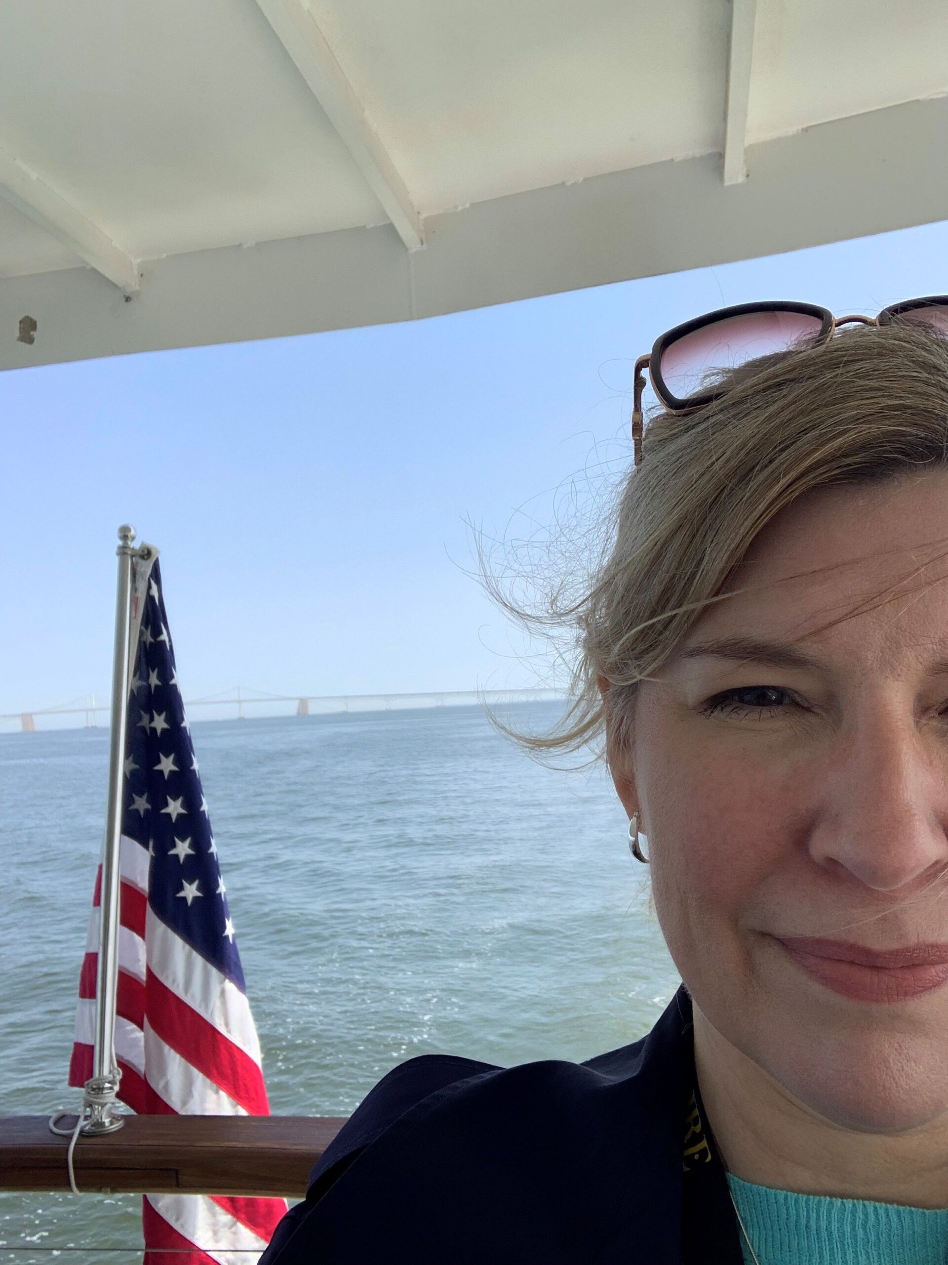 Laura Van Eperen aboard a boat on the Bay during an Elavaire networking cruise