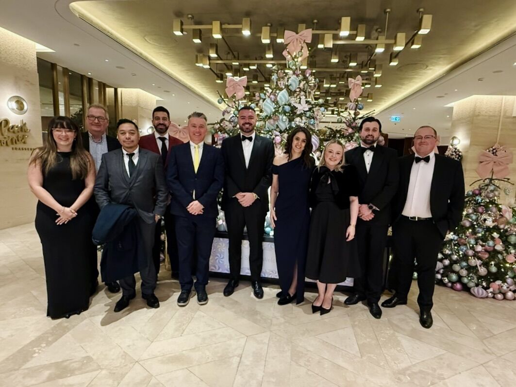 Lauren Whife Akey with Demand AI colleagues at an industry event in London
