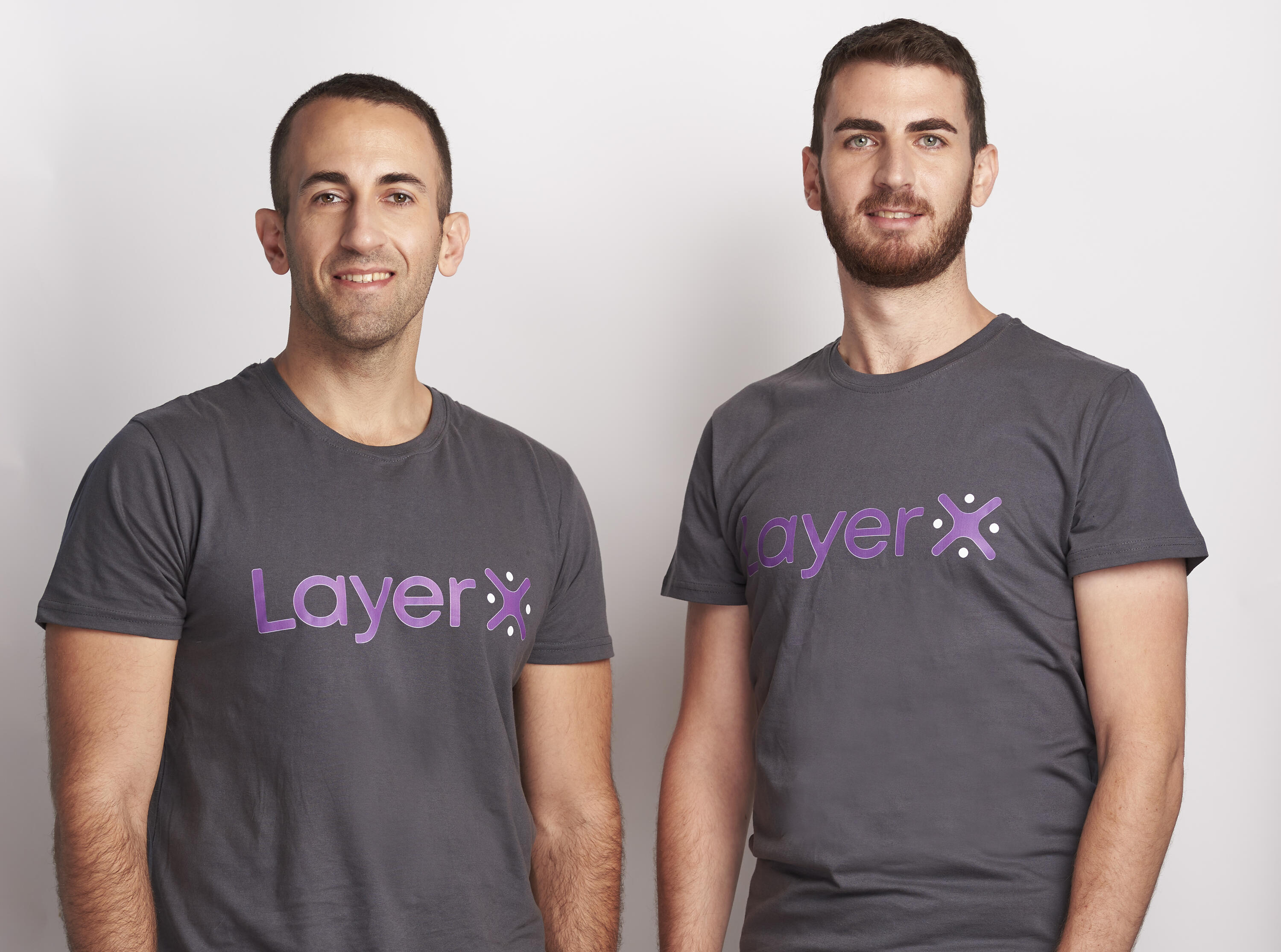 LayerX co-founders Or Eshed and David Vaisbrud wearing company shirts