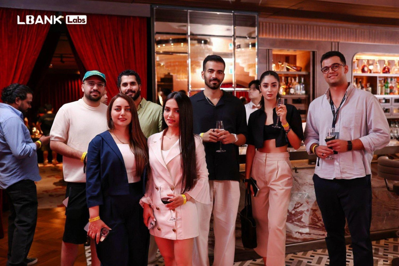 Guests posing together at an LBank Labs gathering in the company’s October 2026 event announcement.