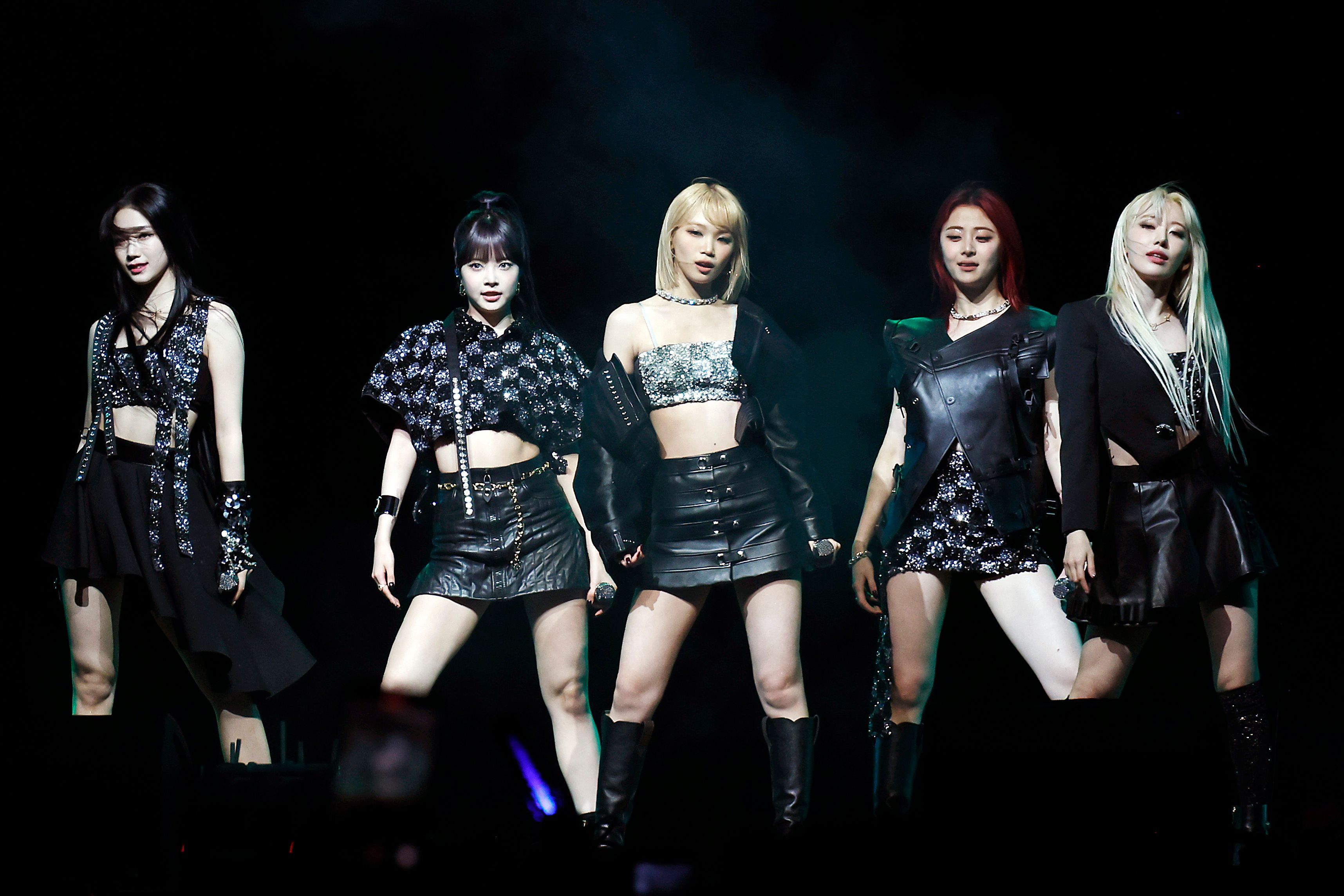 LE SSERAFIM performing together on a dark concert stage at Coachella in 2024