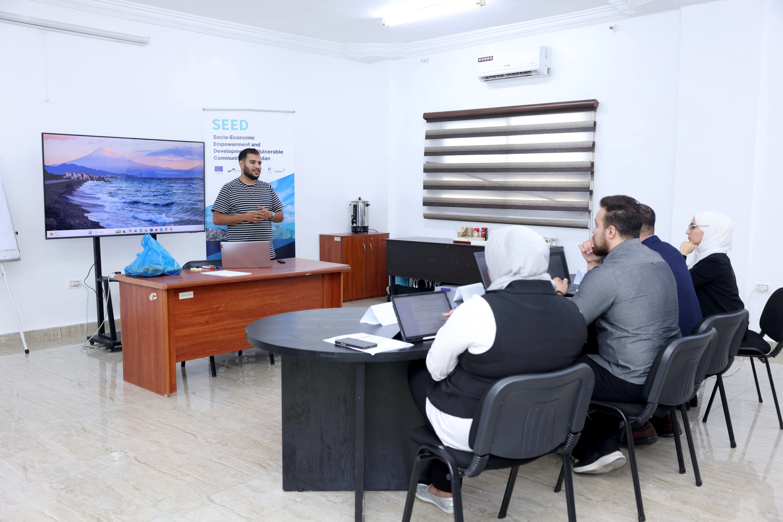 An entrepreneur presents to an evaluation panel at a SEED programme event in Jordan