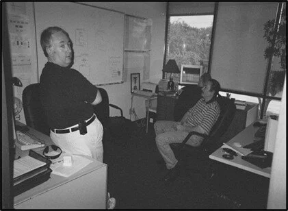 Black and white photograph of an early LeadsOnline office