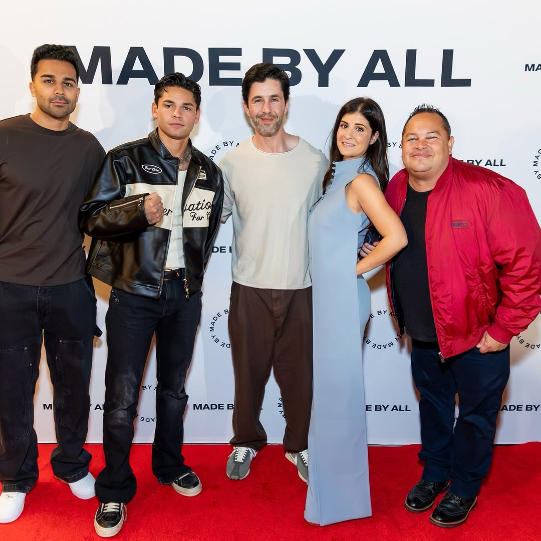 Leanne Perice, second from right in a pale blue dress, with guests at MADE BY ALL’s 2025 holiday party