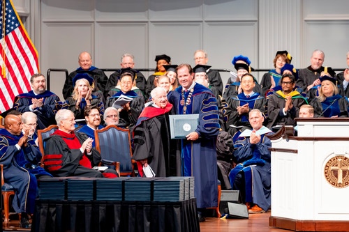 Lee Roy Mitchell receives an honorary degree from Dallas Baptist University President Adam Wright
