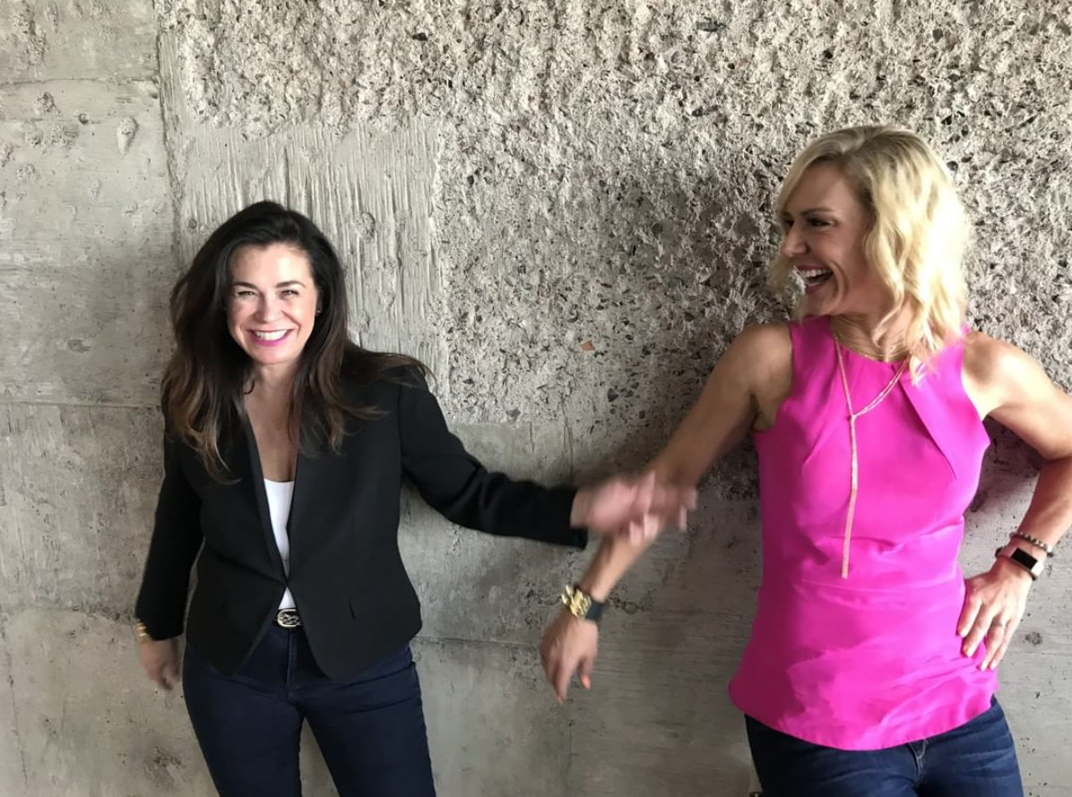 Leigh Dow and a colleague share a candid moment during the 48 West Agency years
