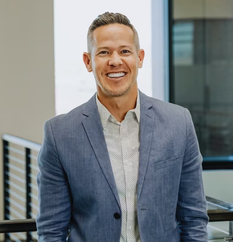 Lendio co-founder and CEO Brock Blake in a gray jacket