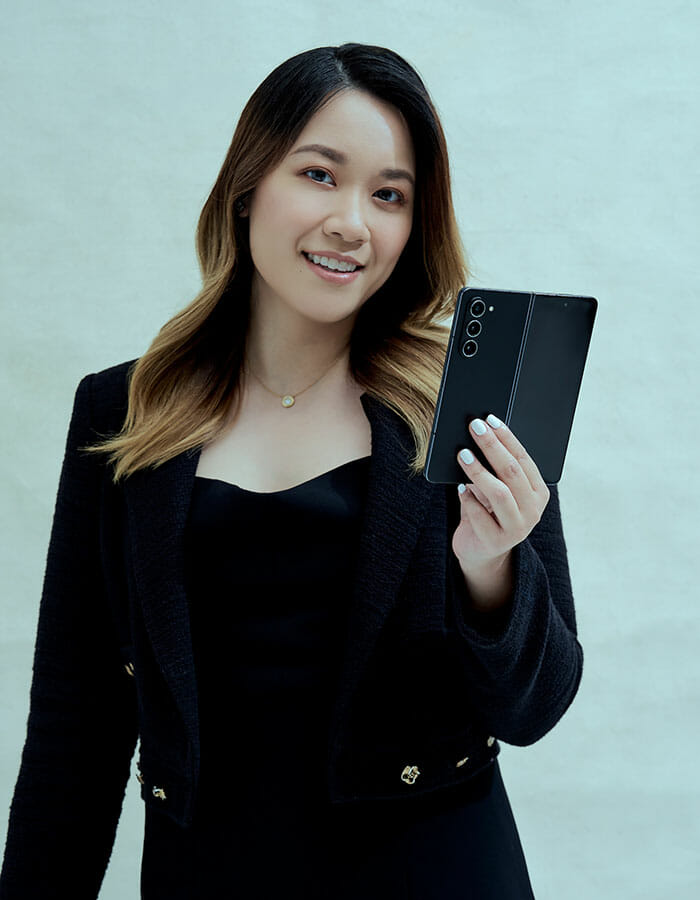 Lennise Ng holding a Samsung Galaxy Z Fold5 during a 2023 editorial photo session
