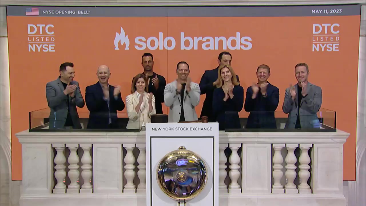 Solo Brands and TerraFlame team members applaud at the New York Stock Exchange opening bell in May 2023