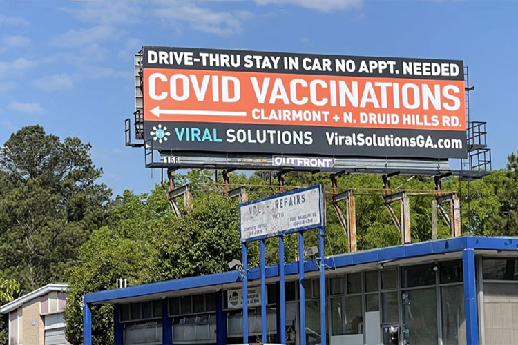 Viral Solutions drive-through COVID vaccination billboard