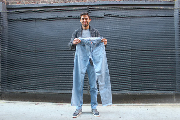Leo Tropeano holding up a pair of jeans in Chicago