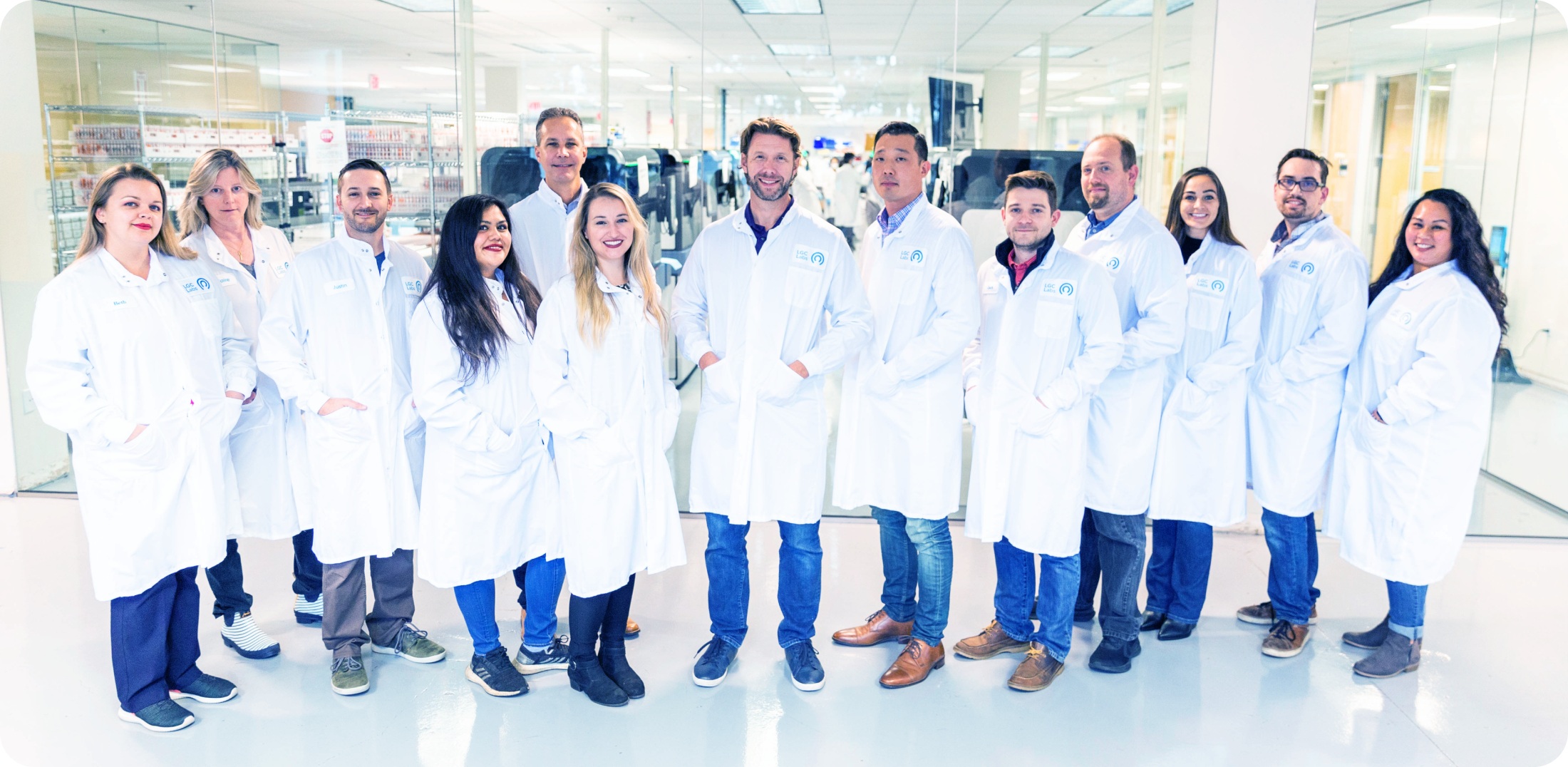 LetsGetChecked clinical staff in white coats standing together inside a laboratory